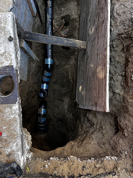 An overhead look down into a trench in San Mateo